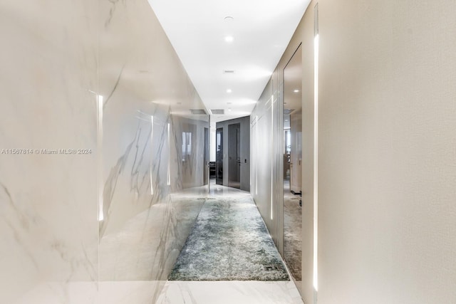 hallway with light tile floors