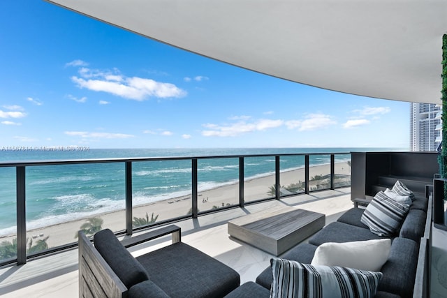 balcony with a water view, an outdoor hangout area, and a view of the beach