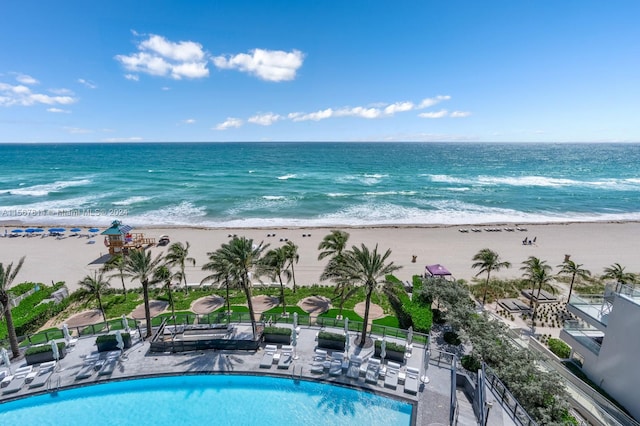 exterior space featuring a view of the beach and a water view