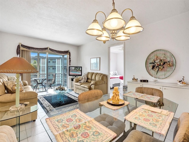 living room with an inviting chandelier, light tile floors, and a textured ceiling