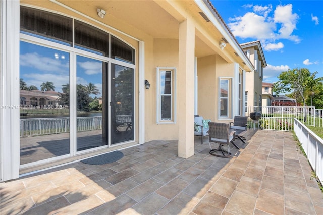 view of patio / terrace with a water view