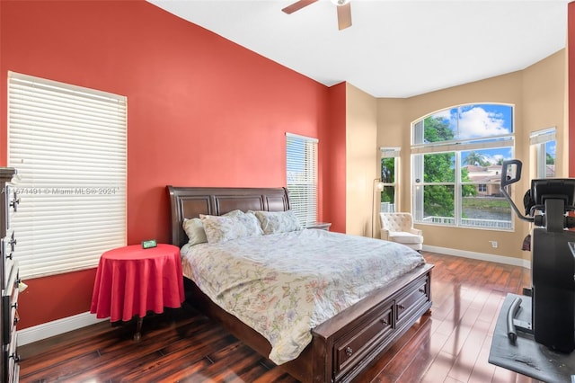 bedroom with ceiling fan and dark hardwood / wood-style flooring