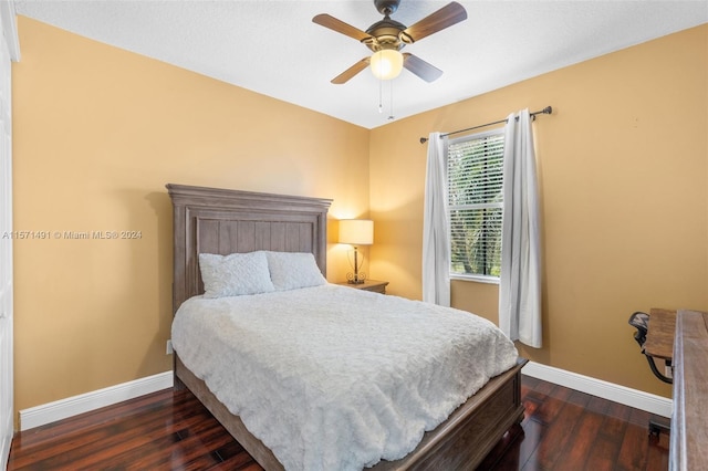 bedroom featuring ceiling fan and dark hardwood / wood-style floors