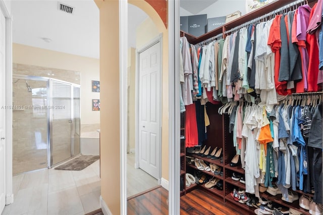 spacious closet featuring tile patterned flooring