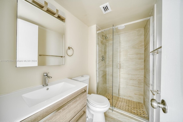 bathroom with walk in shower, vanity, and toilet