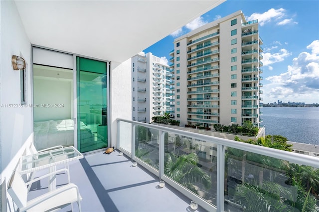 balcony featuring a water view