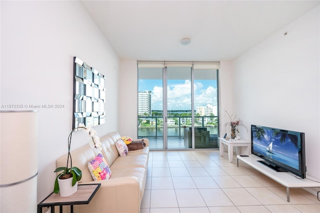 living room featuring floor to ceiling windows and light tile flooring