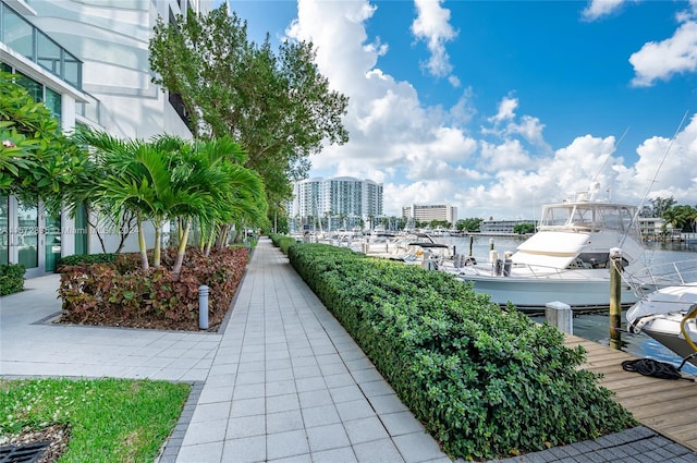 view of home's community featuring a water view and a dock