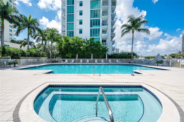 view of pool featuring a community hot tub