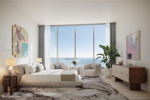 bedroom with a water view, radiator, light hardwood / wood-style floors, and floor to ceiling windows