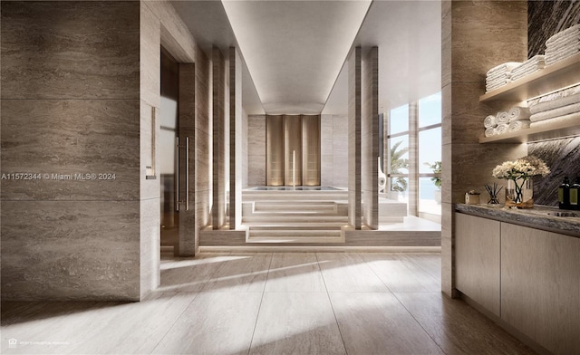 hallway featuring light tile floors