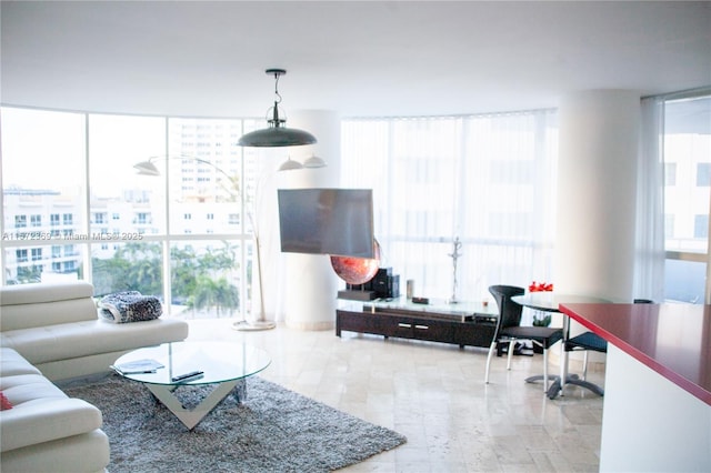 living room featuring floor to ceiling windows