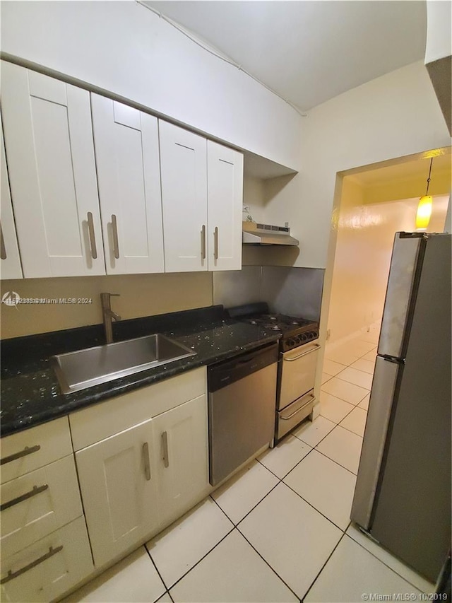 kitchen featuring stainless steel appliances, sink, white cabinetry, and light tile floors