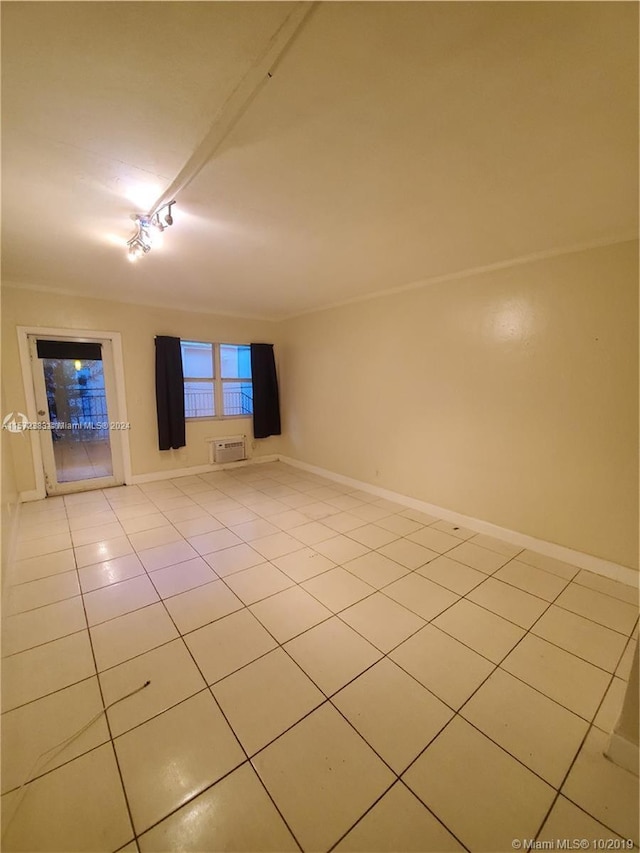 spare room with light tile floors