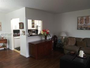 living room with dark hardwood / wood-style floors