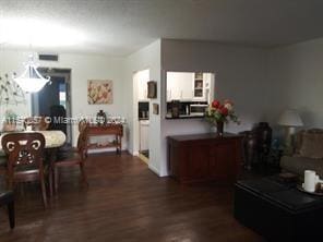 dining area featuring dark wood-type flooring