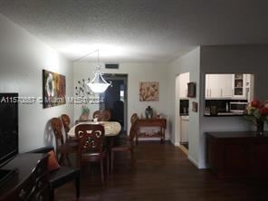 dining space featuring dark hardwood / wood-style flooring