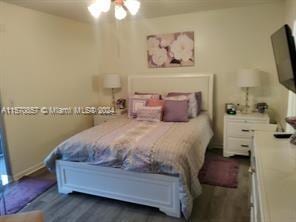 bedroom featuring dark hardwood / wood-style flooring