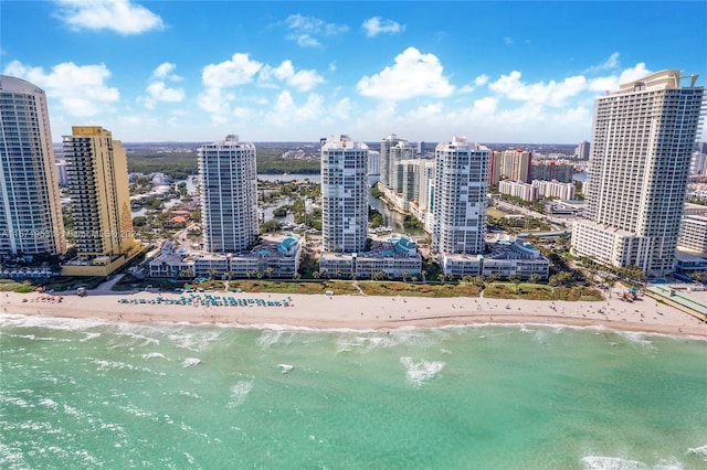 aerial view featuring a water view and a view of the beach