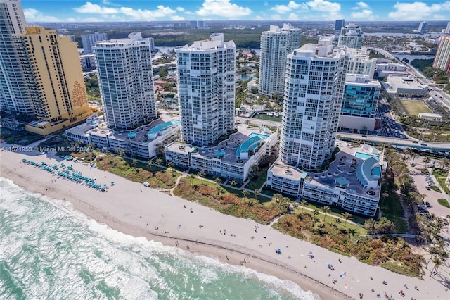 aerial view with a water view and a view of the beach