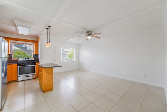 kitchen featuring hanging light fixtures, ceiling fan, stainless steel appliances, and light tile floors