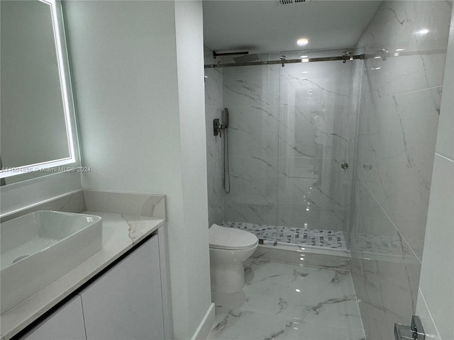 bathroom featuring tiled shower, vanity, toilet, and tile floors