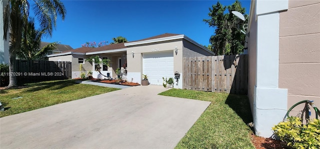 ranch-style house featuring a garage and a front lawn