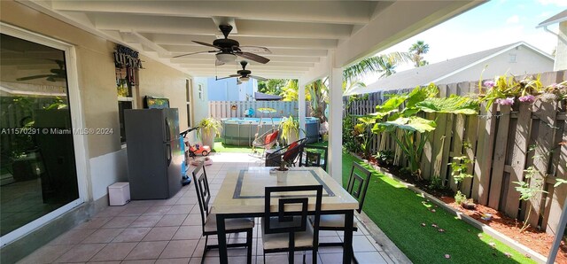 view of terrace featuring ceiling fan