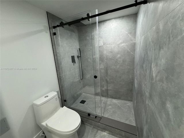 bathroom with walk in shower and toilet