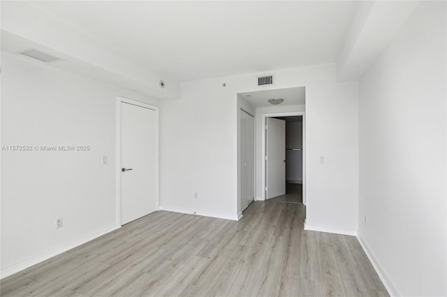 empty room featuring light hardwood / wood-style floors