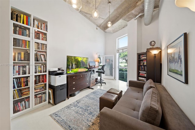 living room with a towering ceiling