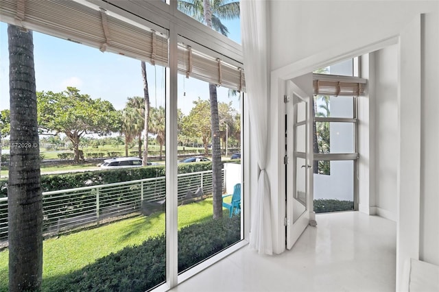 doorway to outside with concrete flooring and plenty of natural light