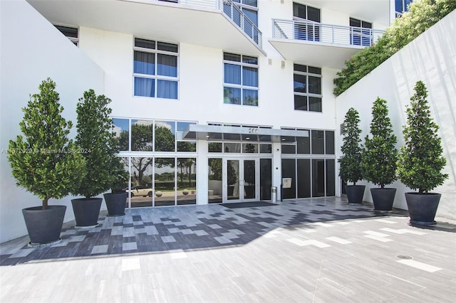 rear view of property with a balcony