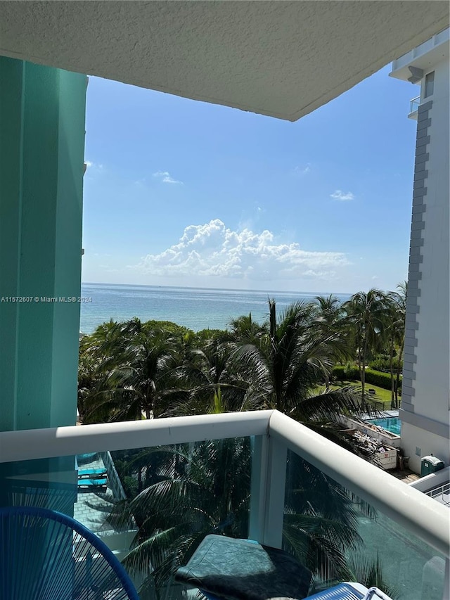 balcony featuring a water view