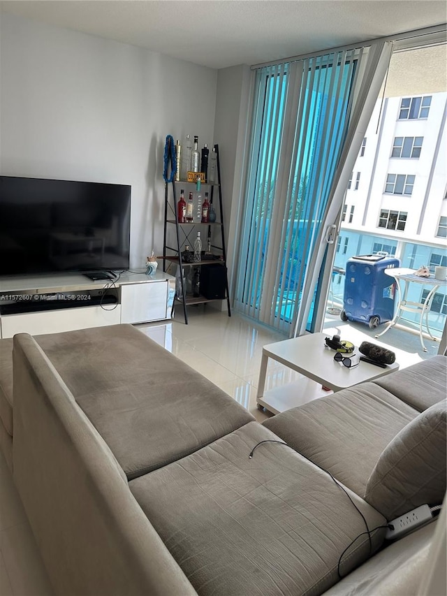 tiled living room with a healthy amount of sunlight