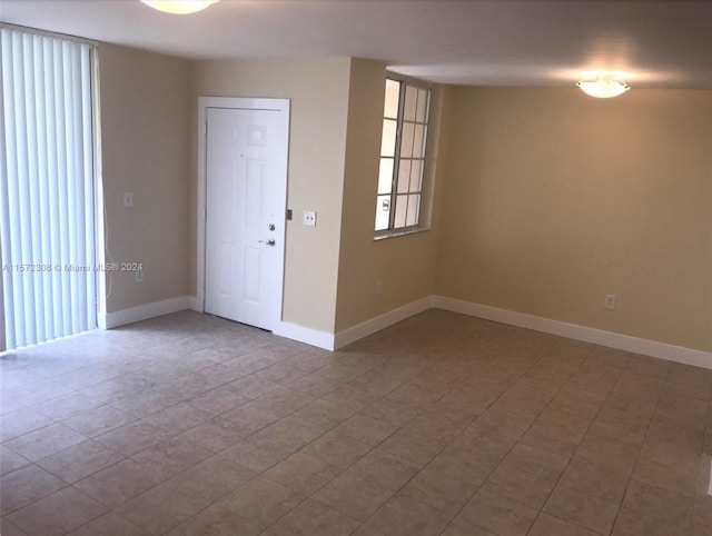 empty room with tile patterned floors