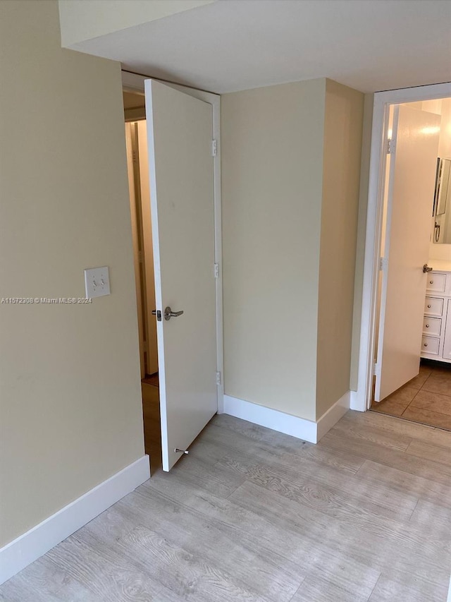 spare room with light hardwood / wood-style floors