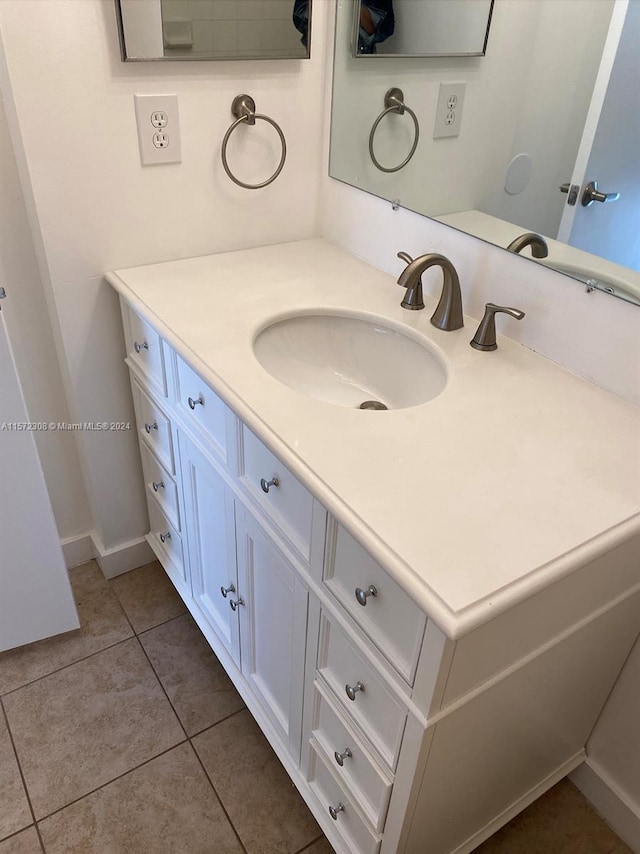 bathroom with vanity and tile patterned floors