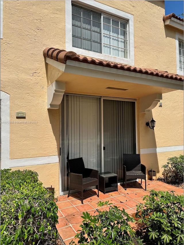 property entrance with a patio