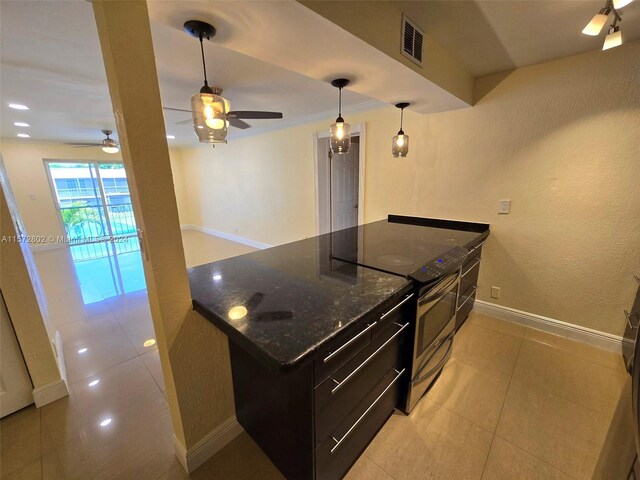 kitchen with light tile patterned floors, stainless steel electric range, dark stone counters, and ceiling fan