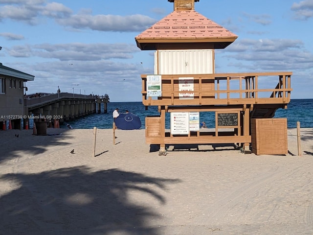 view of playground with a water view