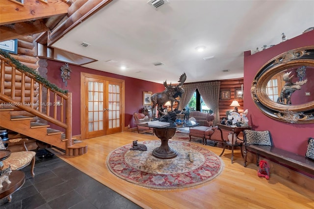 interior space featuring french doors and hardwood / wood-style flooring