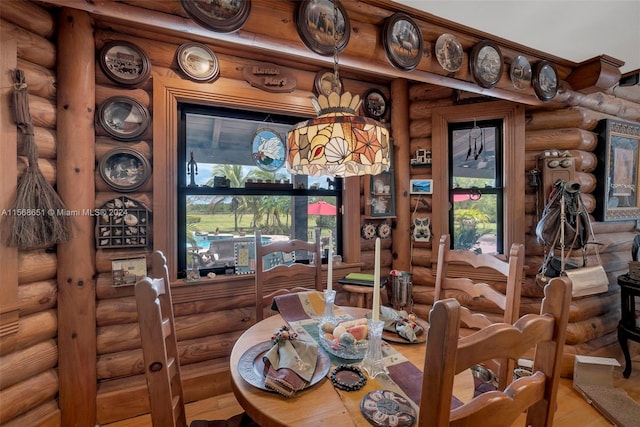 dining space with rustic walls and a wealth of natural light