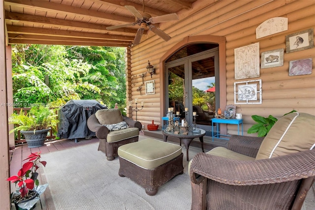 view of patio with ceiling fan and area for grilling