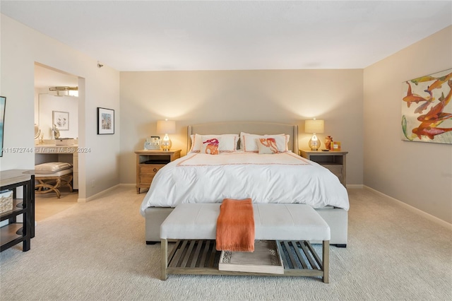 bedroom featuring light carpet