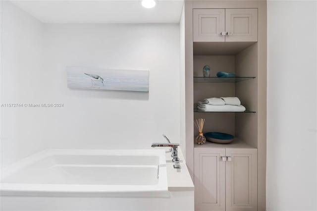 bathroom featuring a washtub