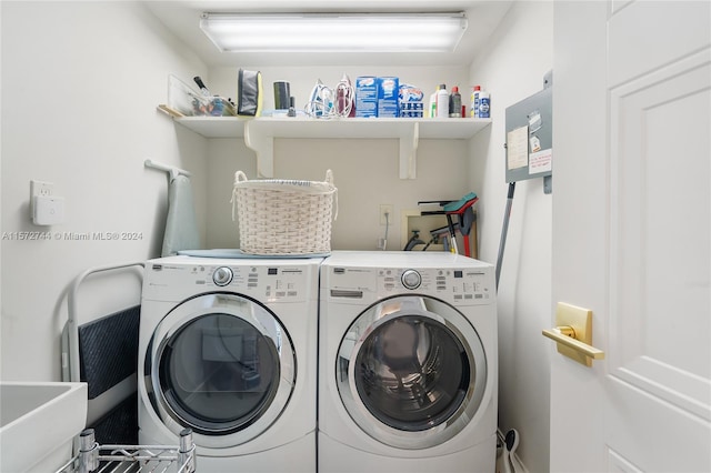 laundry room with hookup for a washing machine and washer and clothes dryer