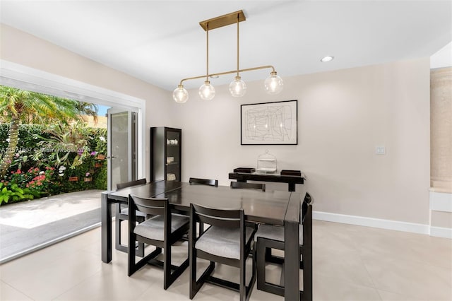 dining area featuring light tile flooring