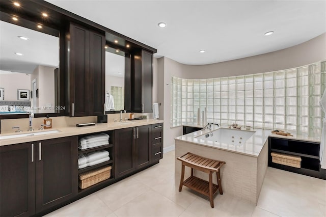 kitchen with sink, plenty of natural light, and light tile floors