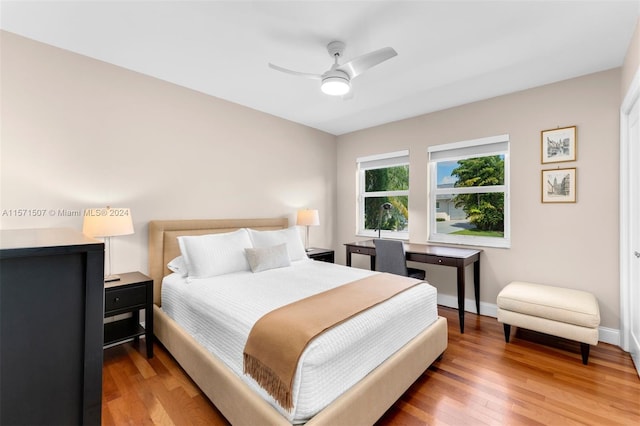 bedroom with light hardwood / wood-style flooring and ceiling fan